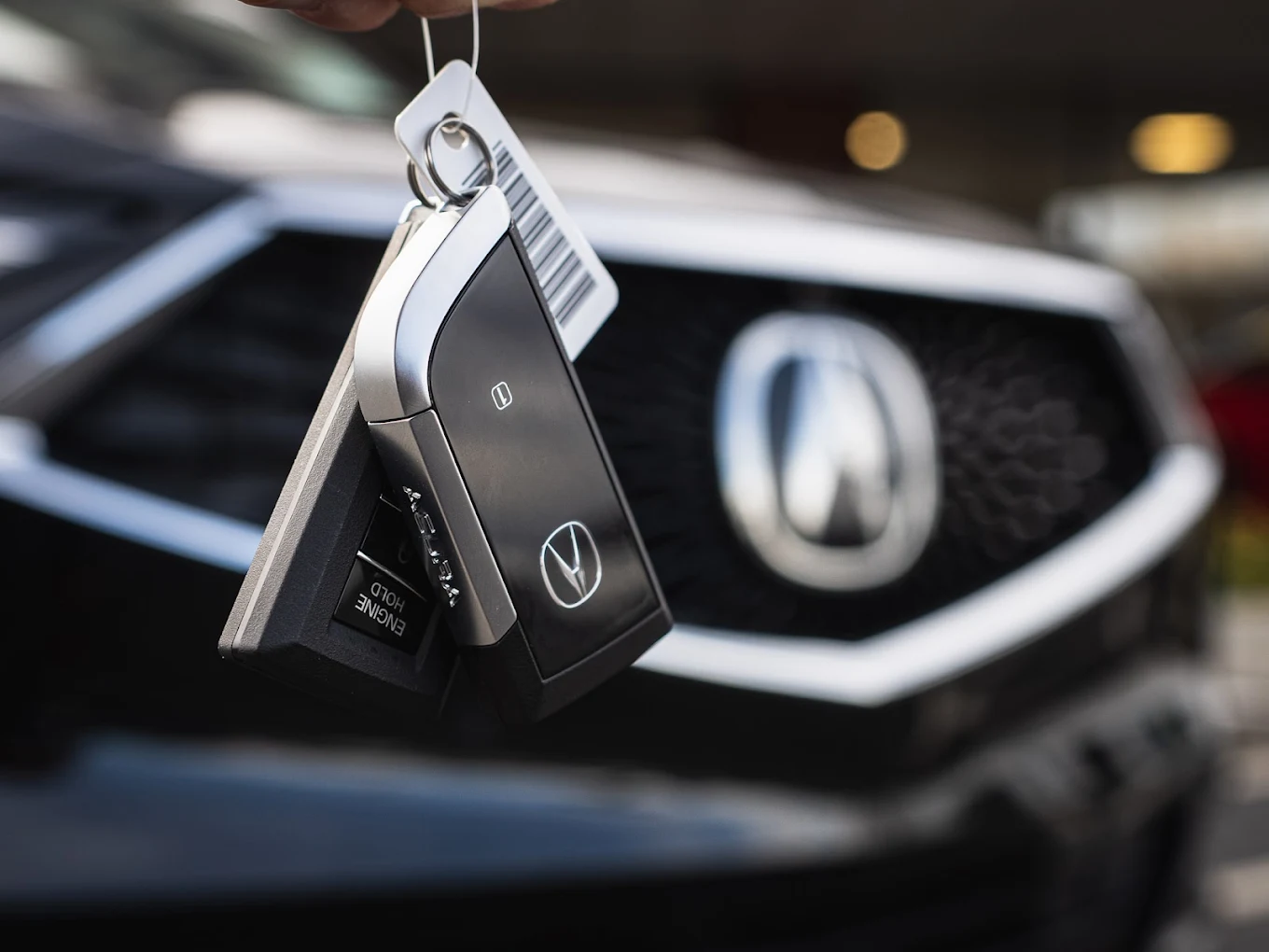 Acura key fobs in front of the Diamond Pentagon grille